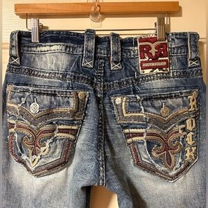 Rock Revival Men’s Bootcut Jeans in Faded Blue with Red and Tan Accents